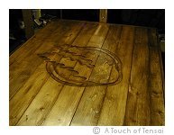 Carved motif tabletop